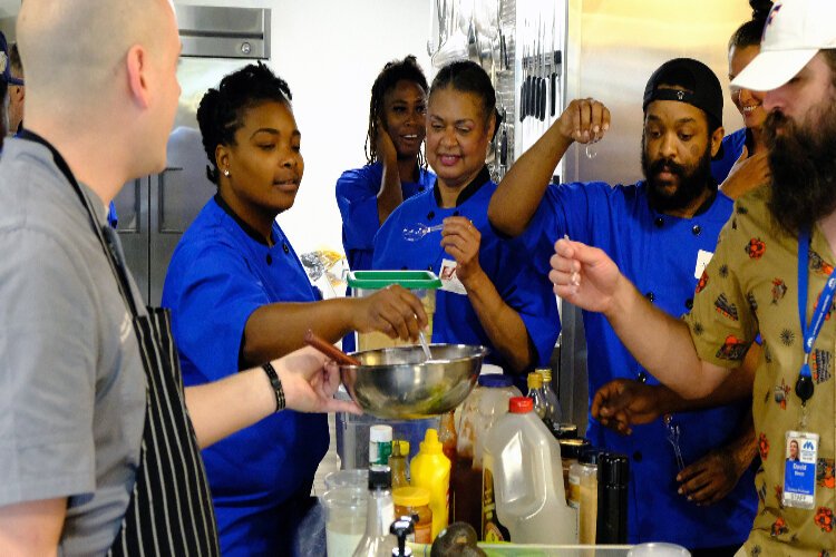 Metropolitan Ministries culinary students created sauces to pair with a meal during a June visit to Monin Inc.'s test kitchen in Clearwater.