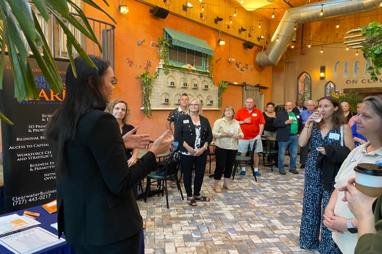 AMPLIFY Clearwater President and CEO Amanda Payne speaks at a meeting of the Clearwater Business SPARK Network. AMPLIFY's new tourism incubator will expand the programming available to entrepreneurs through initiatives like SPARK.