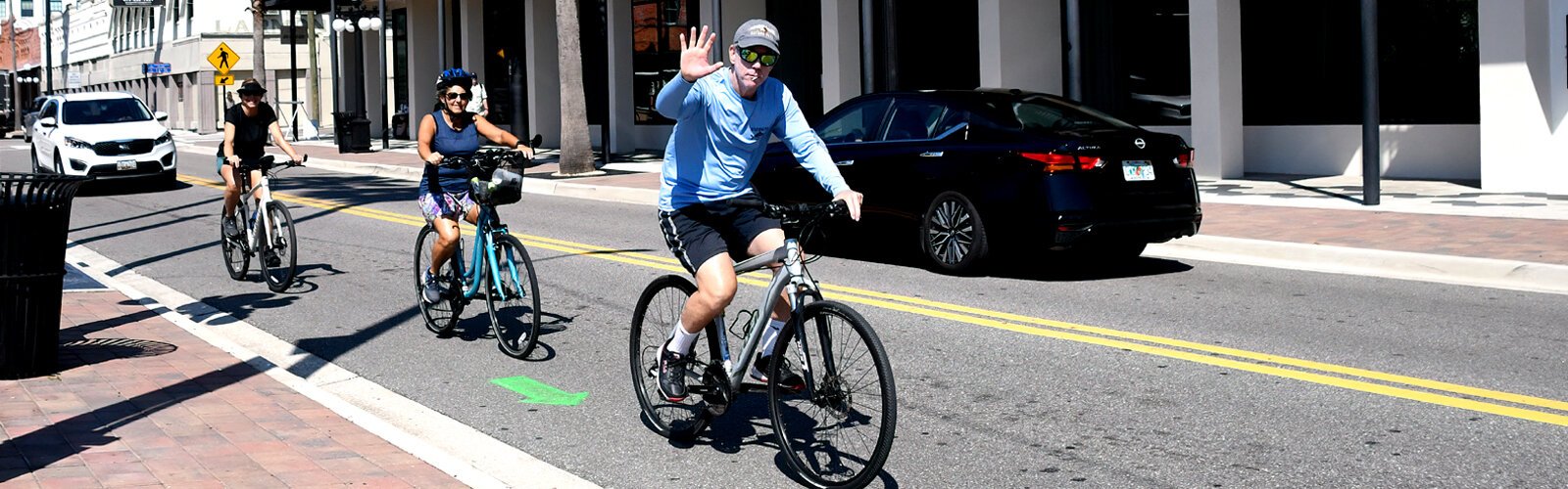 Green arrows painted on the asphalt and well-placed signs guide bicyclists along the recommended route for World Car-Free Day from Midtown Commons to downtown Tampa to Ybor City.