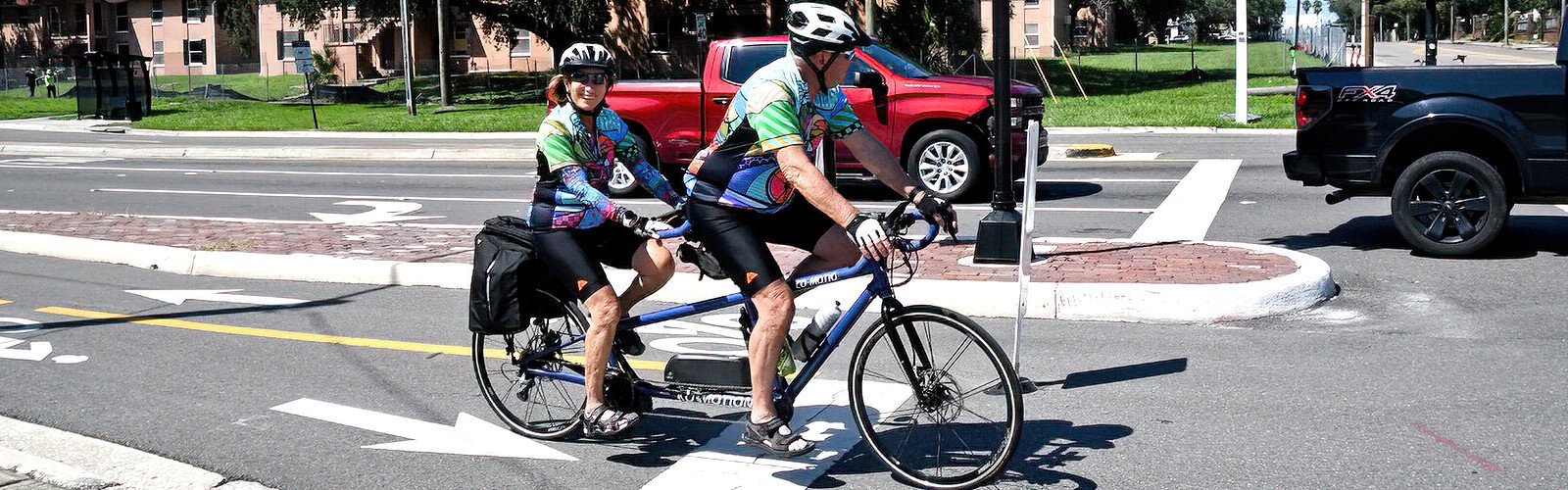 Riding in tandem along Nuccio Parkway, a couple celebrates World Car-Free Day, a day with less traffic congestion, a greener environment and reduced gasoline demand.