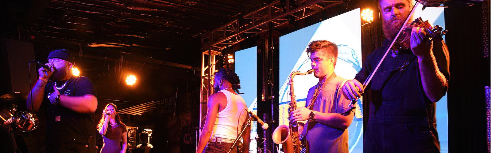 Rapper Sam E Hues performs with his band at Crowbar during the Vibes of the Bay festival.