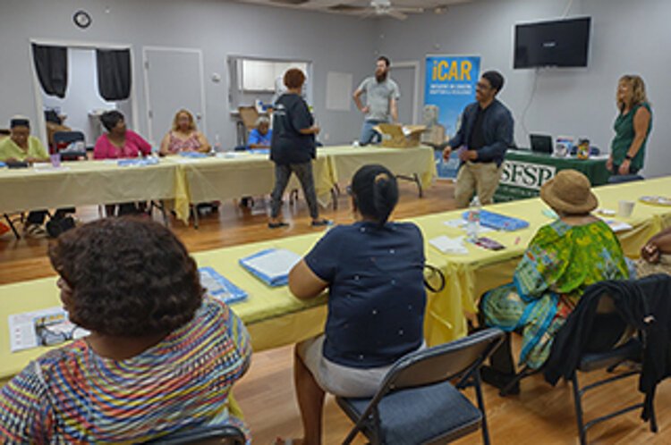 The USF Initiative on Coastal Adaptation and Resilience will use outreach efforts similar to this town hall meeting on flooding to get community input on the CRIS-HAZARD app USF is developing in partnership with Georgia Tech University.