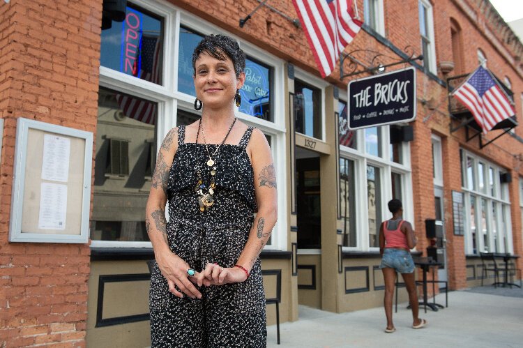 Artist Michelle Sawyer in front of The Bricks in Ybor City. Sawyer took over last July as curator of the gallery space inside the popular Ybor City bar and restaurant.