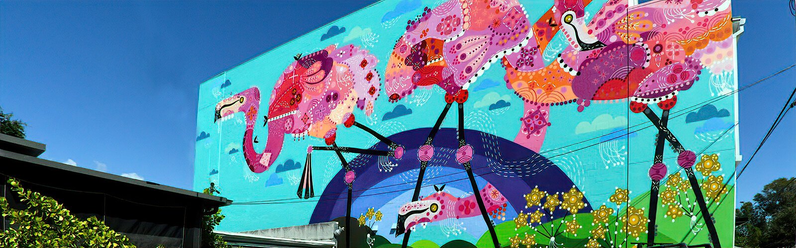 The flamingo pink wave is beautifully depicted in the heart of St Petersburg by California artist Bunnie Reiss for the 2023 SHINE Mural Festival, which was presented by REFLECTION St Pete.