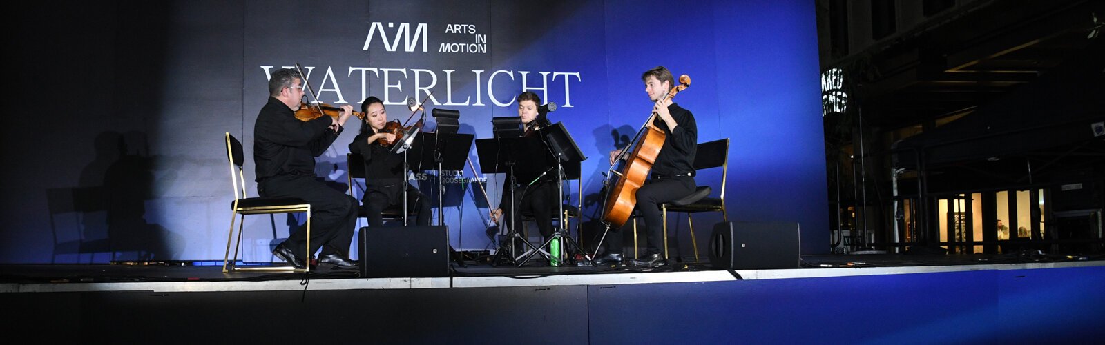 As part of the Arts in Motion WATERLICHT experience, a string quartet from The Florida Orchestra entertained the audience at Raybon Plaza on Sunday night, with classical pieces by Mozart, Bach and others.
