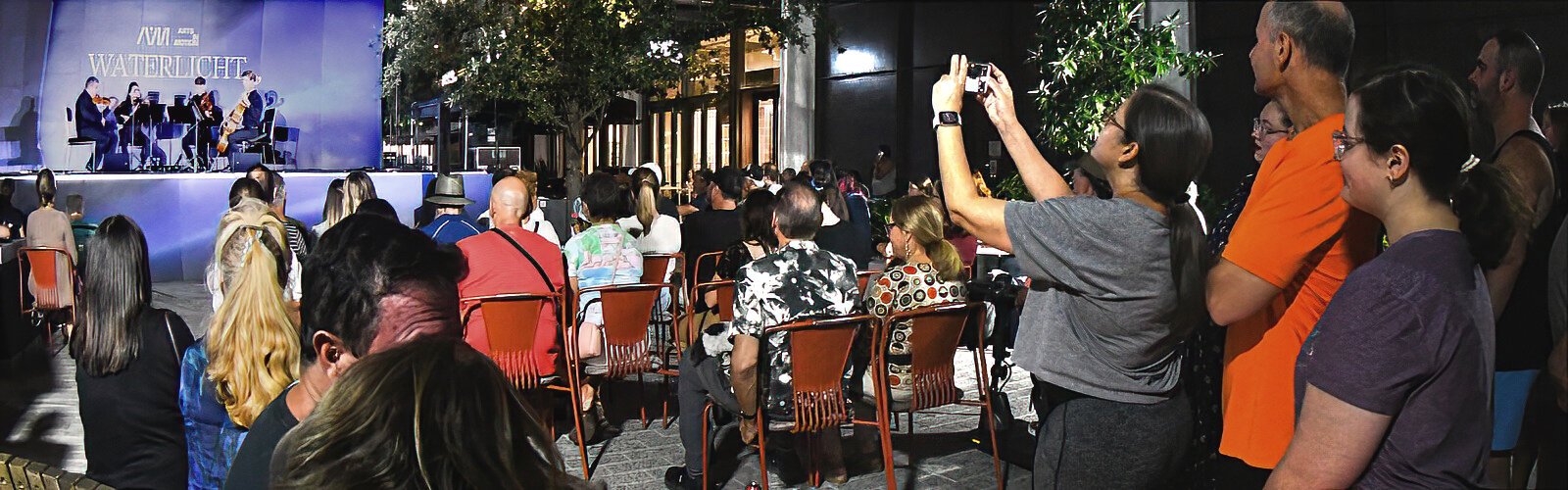 Captivated by the magic of lights and music, hundreds took part in the WATERLICHT experience on Water Street Tampa.