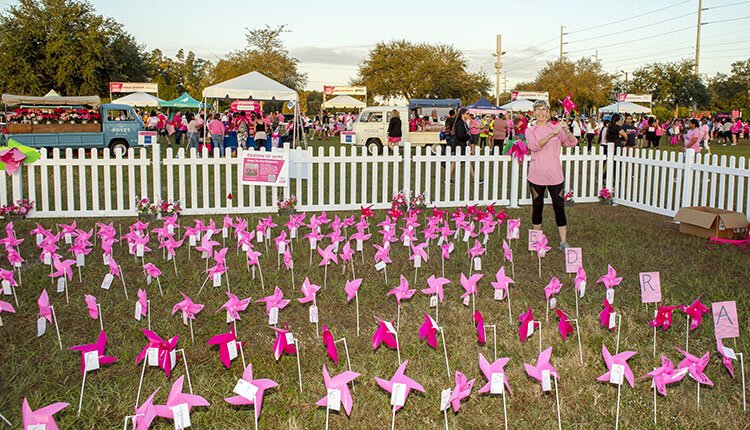 Tampa's Susan Fernandez, a volunteer committee member for the American Cancer Society's Making Strides Against Breast Cancer Walk, stands in the Garden of Hope, where visitors can add the name of a loved one to a pinwheel.