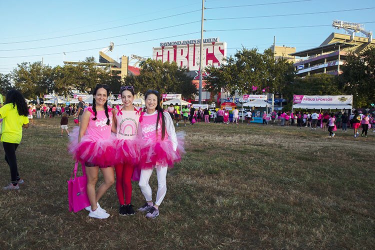 Felice Rogers, Isabel Evans and Carolyn Ogden, members of the Tampa General Hospital Clinical Education Department, at the American Cancer Society's Making Strides Against Breast Cancer Walk at Raymond James Stadium.
