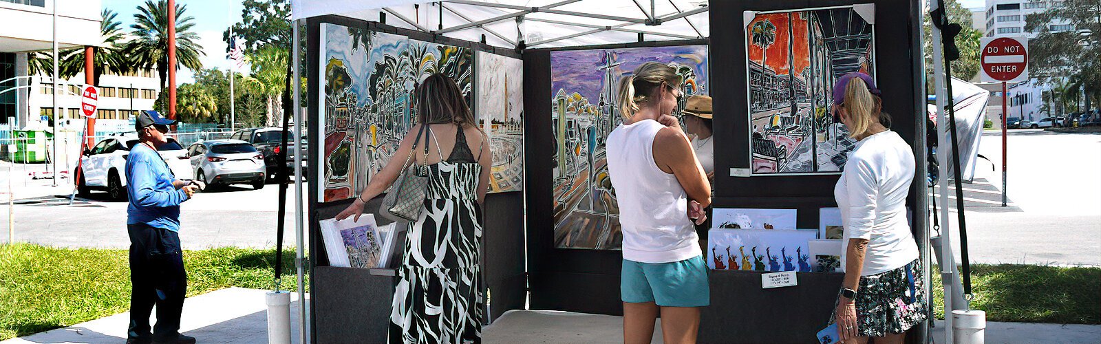 The vibrant energy in the cityscape artwork of Patricia Kluwe Derderian attracts visitors to her booth at Coachman Park’s “Art in the Park."