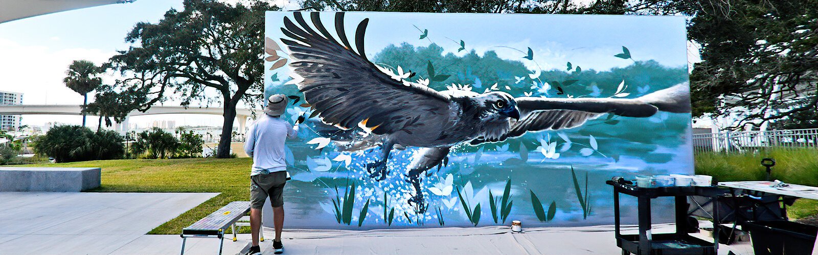 During Art in the Park, Miami-based international muralist Ernesto Maranje works live on a mural at Coachman Park, exploring fauna and flora with brush and spray paint.