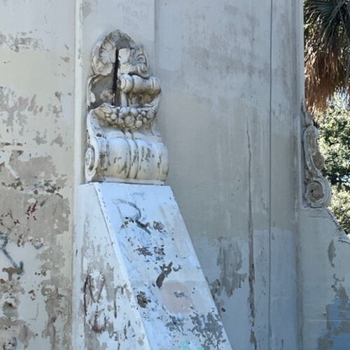 A crumbling decorative feature at the base of the Sulphur Springs Water Tower.