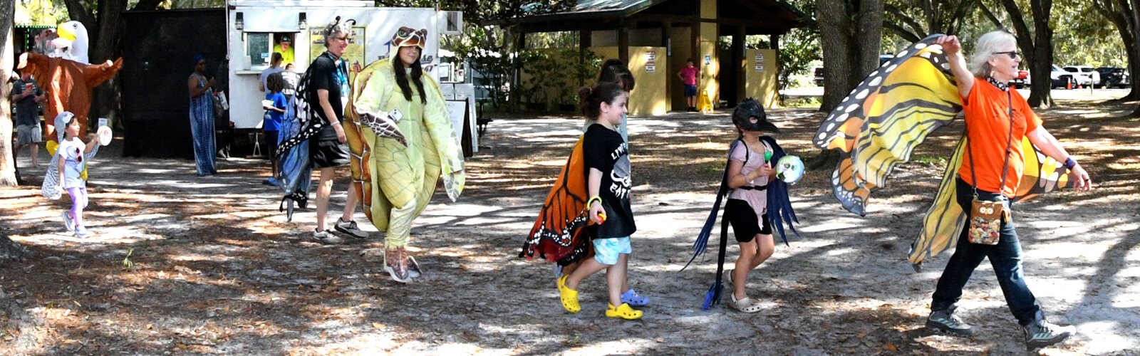 A small but fun animal costume parade is led by Nancy Murrah, the president of the Raptor Center of Tampa Bay, the organization that presents the annual Wonders of Wildlife Festival in Plant City.