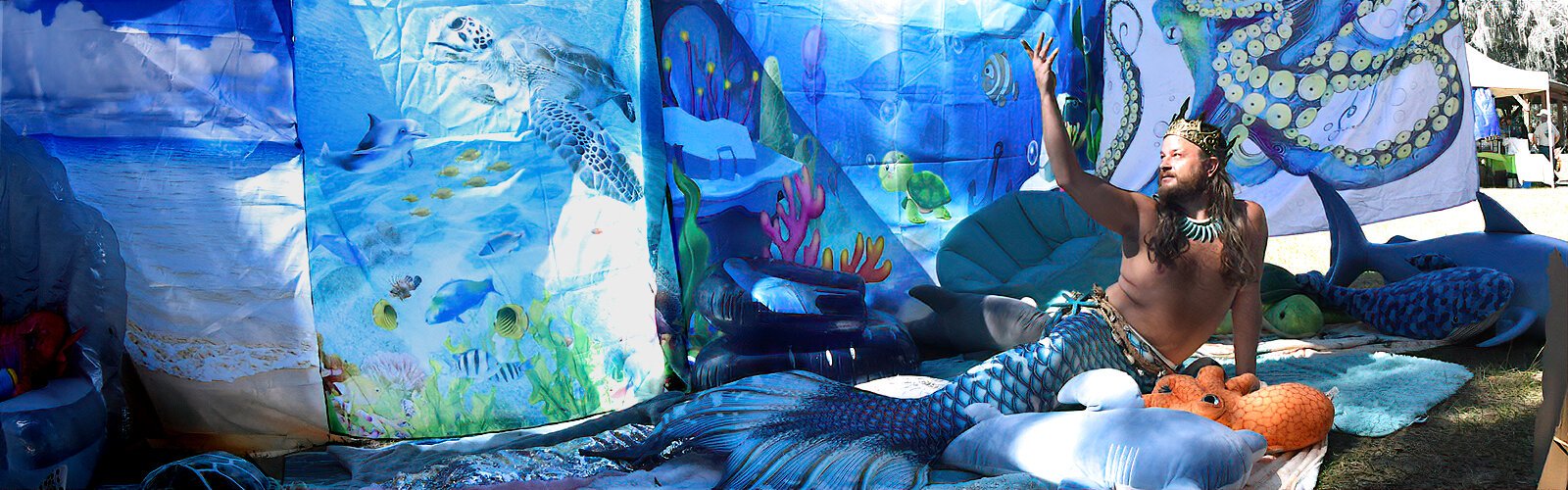 Aiden the Merman, a Tampa Bay dedicated seabird rescuer and avid diver, adds a touch of sweet fiction at the Wonders of Wildlife Festival by posing as a merman in the mermaid section. 