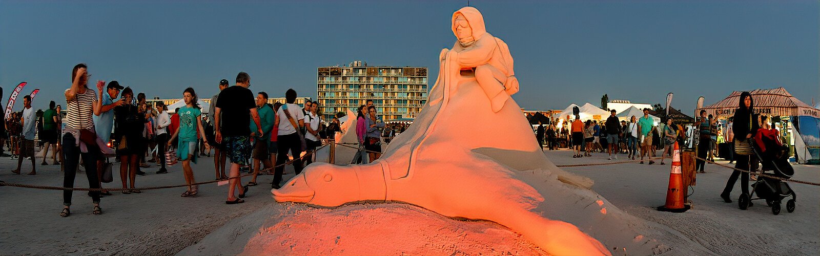 A young pilot on a duck by Jobi Bouchard (Canada) and this year’s event designer/local sculptor Dan Doubleday (Treasure Island FL) reminds us that time flies, but we are the pilots!