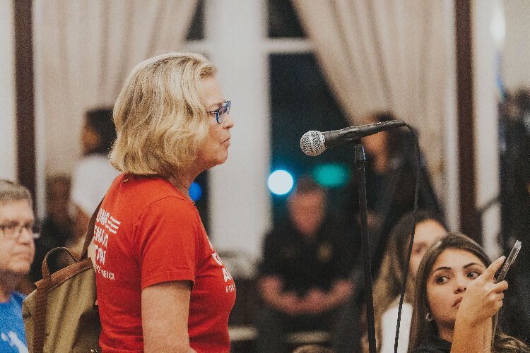 A representative of the nonprofit group Moms Demand Action speaks at a Tampa Police town hall meeting to discuss the Halloween weekend Ybor City shooting and offers to give out free gun locks after the meeting.