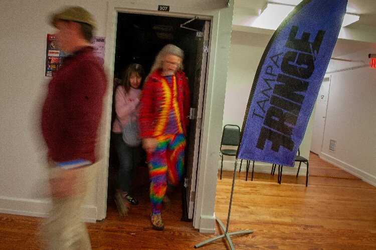 Attendees rush from one performance to another during the Whinge! Festival in the historic Ybor Kress Building. Presented by Tampa Fringe, the event requires performers to try out acts for the first time.