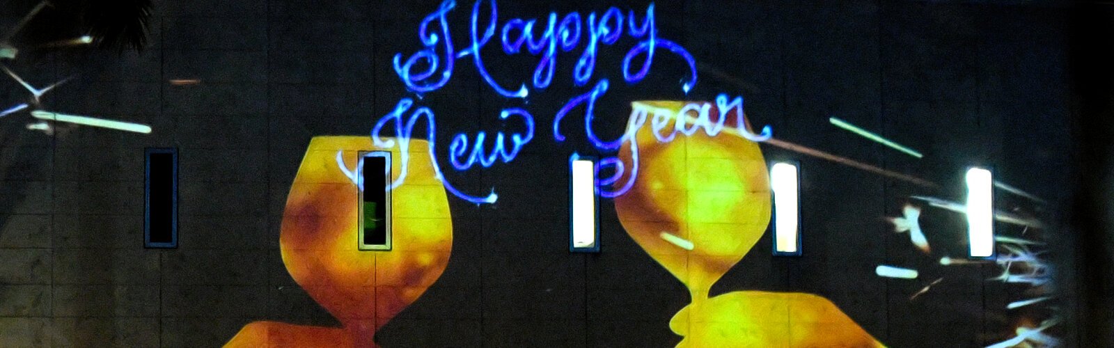 A message from digital decoration company FX Projections wishes the crowd a Happy New Year 2024 as the 30th annual First Night St Petersburg returns after a hiatus with a bigger than ever celebration of the arts.