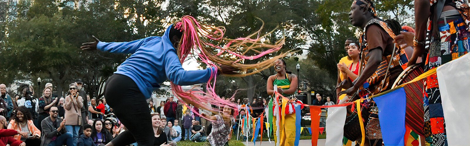 Enthralled by the Dundu Dole performance, a spectator spontaneously lets her long pink strands of hair loose and dances her way to the dancers to everyone’s delight.
