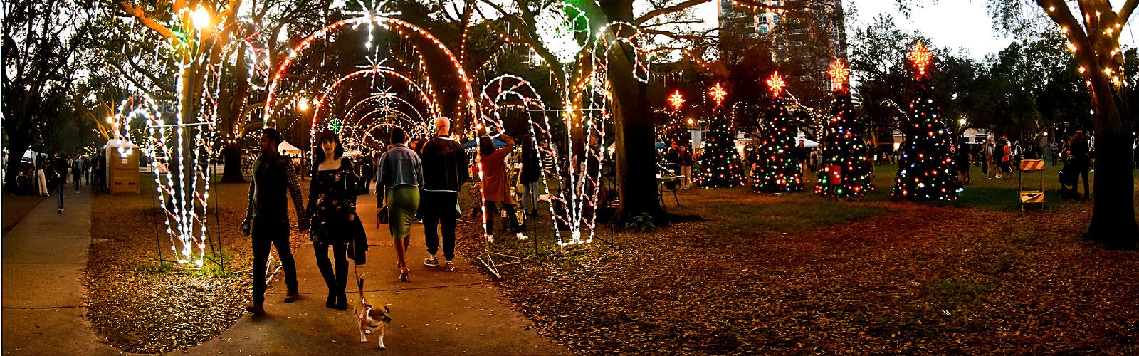 First Night goers walk through festive displays of lights and decorations to reach the various stations of entertainment and creative activities.