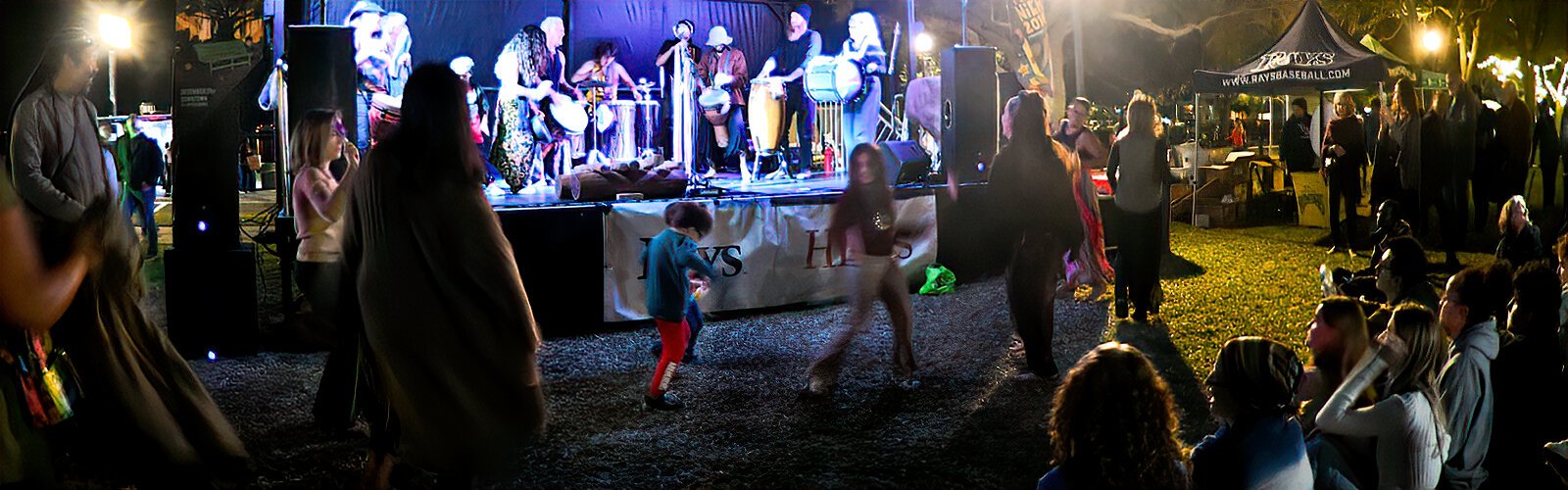 The funky rhythm of the Urban Gypsies of Florida makes the audience move, dance and have fun in front of the main stage at First Night St. Petersburg.