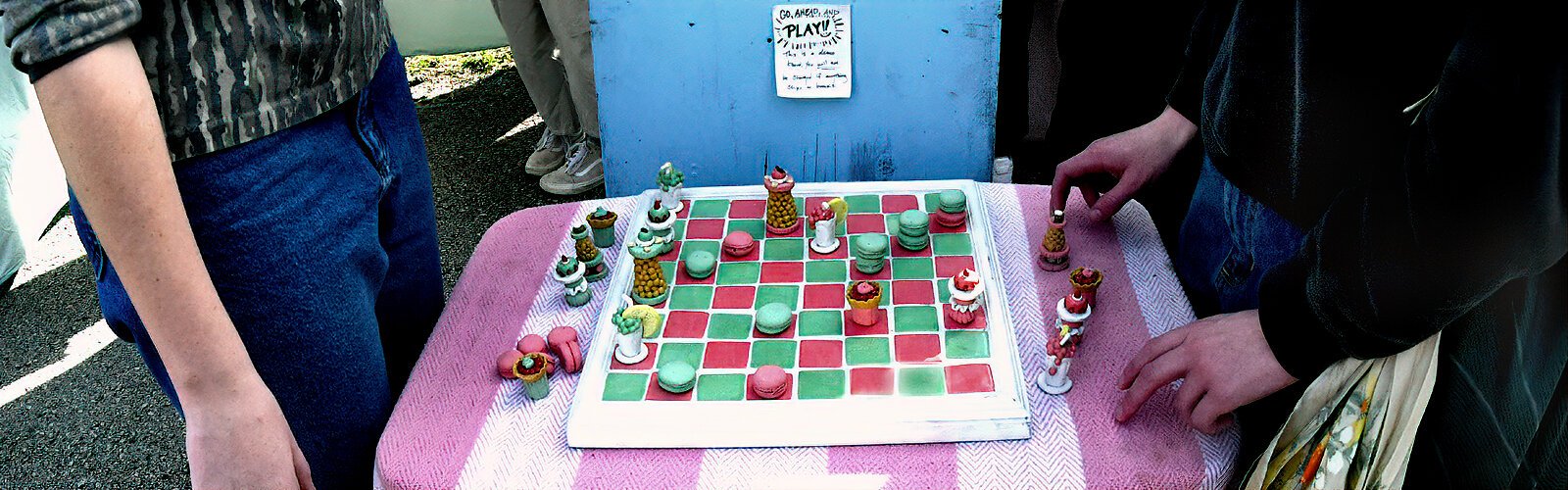 With a posted note to “Go ahead and play!! You will not be charged if anything chips or breaks," it’s hard to resist this attractive demo chess set made of ceramic macarons and cupcakes.