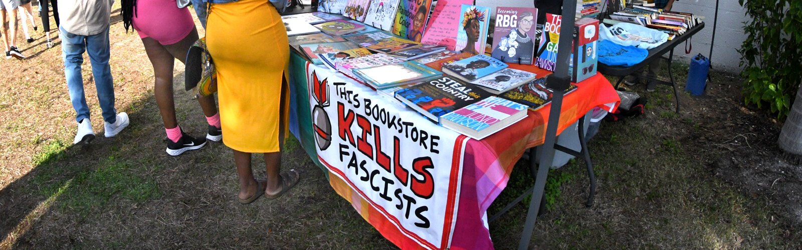 Capturing people’s attention with the name “This Bookstore Kills Fascists," a selection of books banned from schools and libraries across the United States attracts a crowd at the Indie Flea St. Pete.