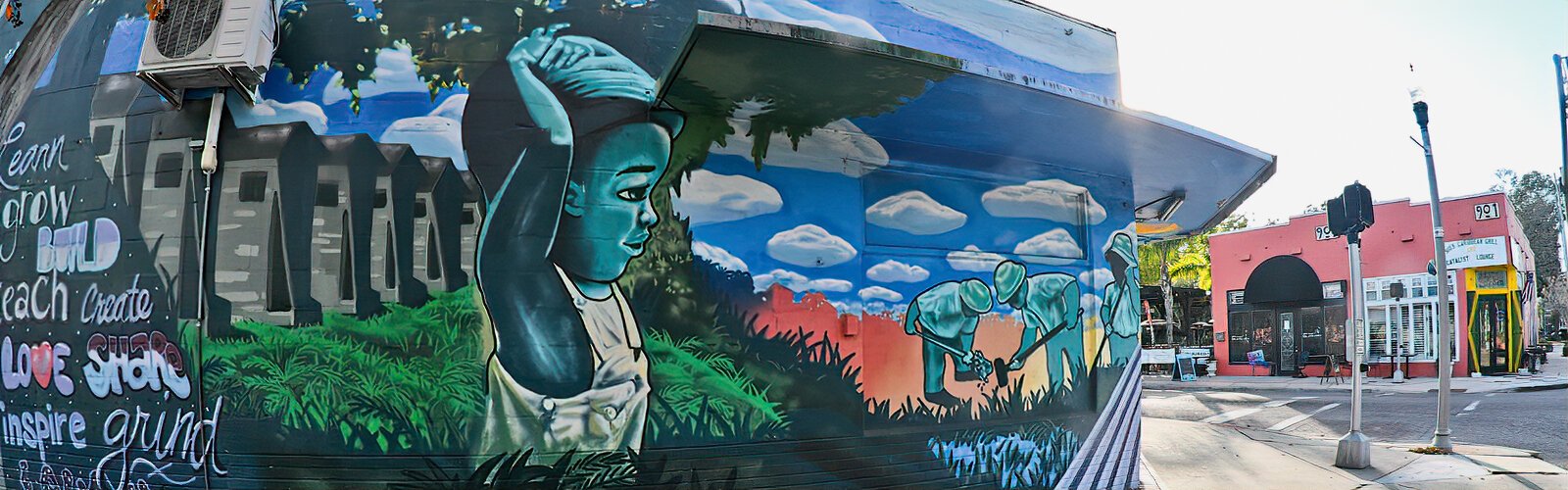 At the corner of 22nd Street South and Ninth Avenue South, a mural inspires residents to cultivate and grow their own food to stop dependence on the grocery store.