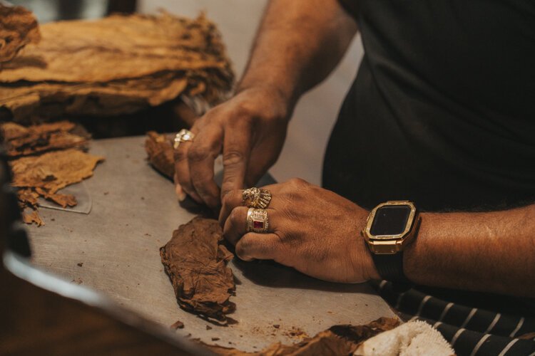 Workers at El Reloj hand roll cigars using the same technique Julius Caesar Newman used in 1895.