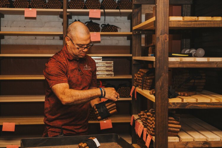 J.C. Newman's Gene Haines in the aging room of El Reloj.