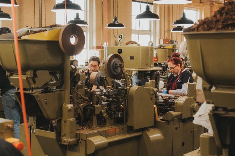 J.C. Newman workers machine roll cigars on the same equipment company founder Julius Caesar Newman purchased in 1930.