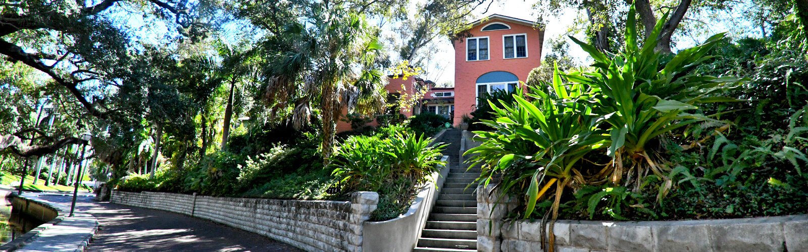 Sitting on top of a hill with a view of Booker Creek, this beautiful house built in 1910 is of Mediterranean Revival style.