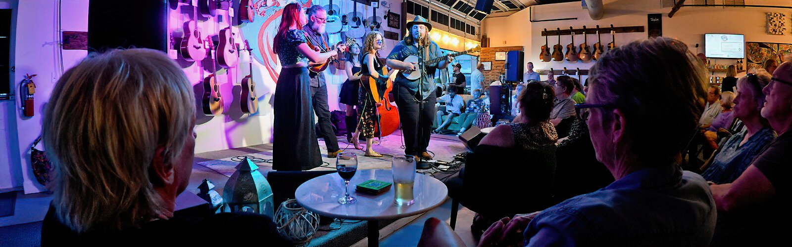 The Wandering Hours band entertains visitors in the Seven C Music studio and guitar specialty shop during the Second Saturday ArtWalk in St Pete’s Warehouse Arts District.