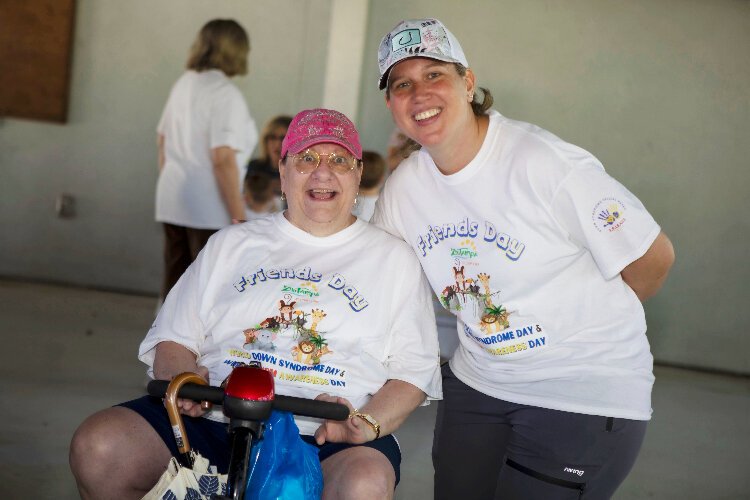 Ann Foyt, former president of F.R.I.E.N.D.S.-Down Syndrome/Special Needs West Florida, and Adhley Odom, the current president, at a ZooTampa event on March 23rd.