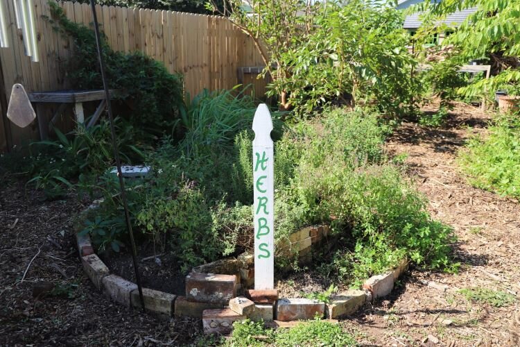 WellFEd Community's community garden off Ybor Street has bountiful fruit trees, vibrant plant beds, a variety of herbs and a pollinator garden drawing in bees and butterflies.