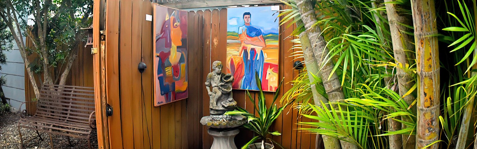At the 8th annual Historic Kenwood Tour of the Arts, artist Maurice Bartikofsky’s paintings are showcased in an outdoor paito area