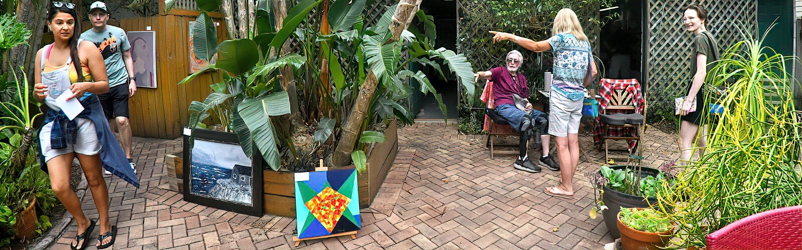  At the Tour of the Arts in St. Pete’s Historic Kenwood neighborhood, painter Grandy Smith directs visitors to his paintings, which are on display in the patio he shares with artist Maurice Bartikofsky.