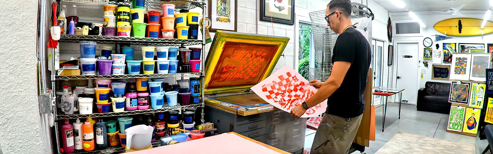  Graphic designer and screenprinting artist Mike Toh demonstrates how to pull a screen print poster in his studio in St Petersburg’s Historic Kenwood.