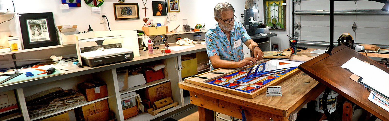 A local artist specializing in stained glass and mosaic art, Michael Baker works on an art piece in his studio open to visitors during the Historic Kenwood Tour of the Arts.