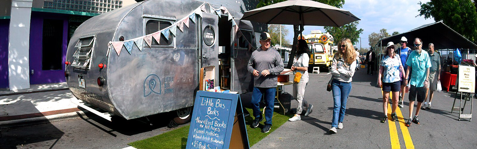  A family-owned mobile community bookshop, Little Bus Books sells new and used books at market events in Polk County.