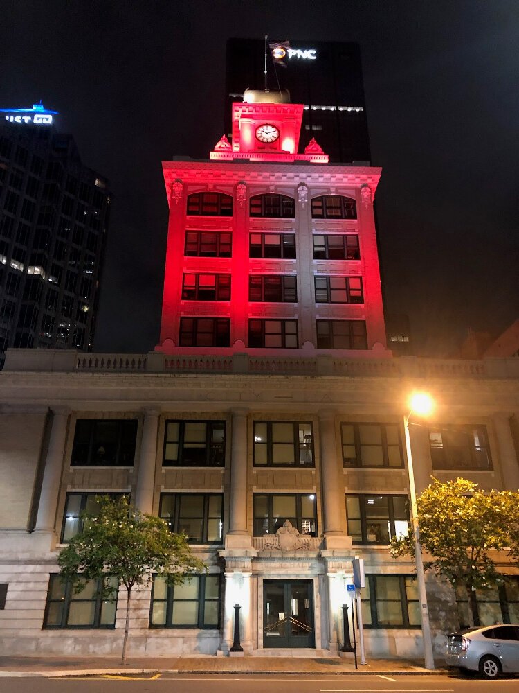 Tampa City Hall is lit up orange for the peace walk at the Wear Orange event to stop gun violence.