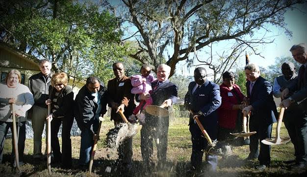 Community leaders break ground on the first phase of the Nehemiah Project in January 2014.