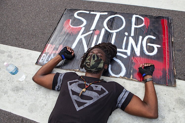 A peaceful sit-in in downtown Tampa demonstrated the 9 minutes George Floyd was held down before he died in Minneapolis.