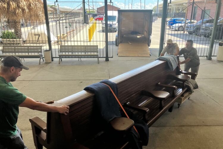 A pair of renovated antique train station waiting room benches have a new home at Tampa Union Station 